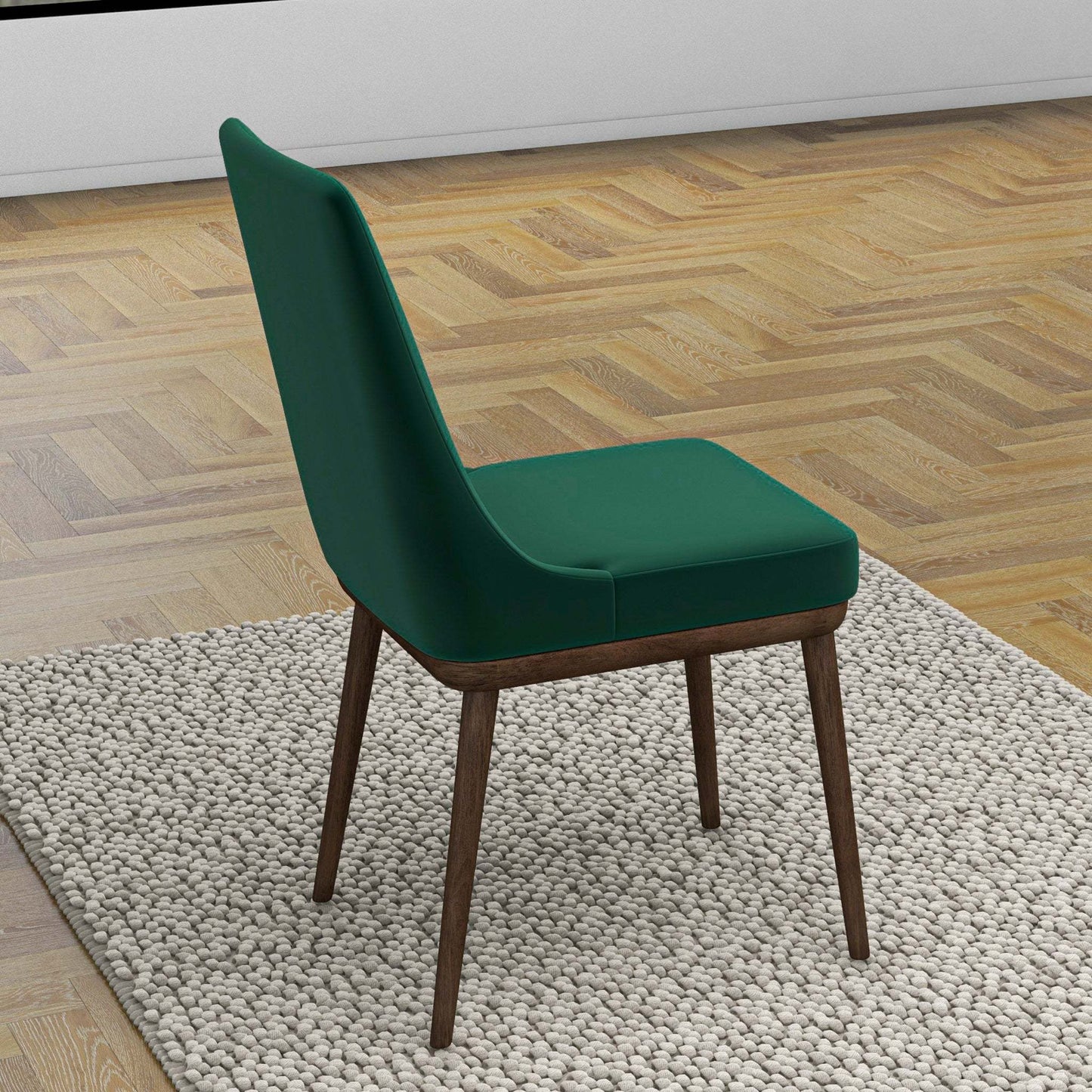 Modern green upholstered dining chair with wood legs on a textured rug, parquet floor