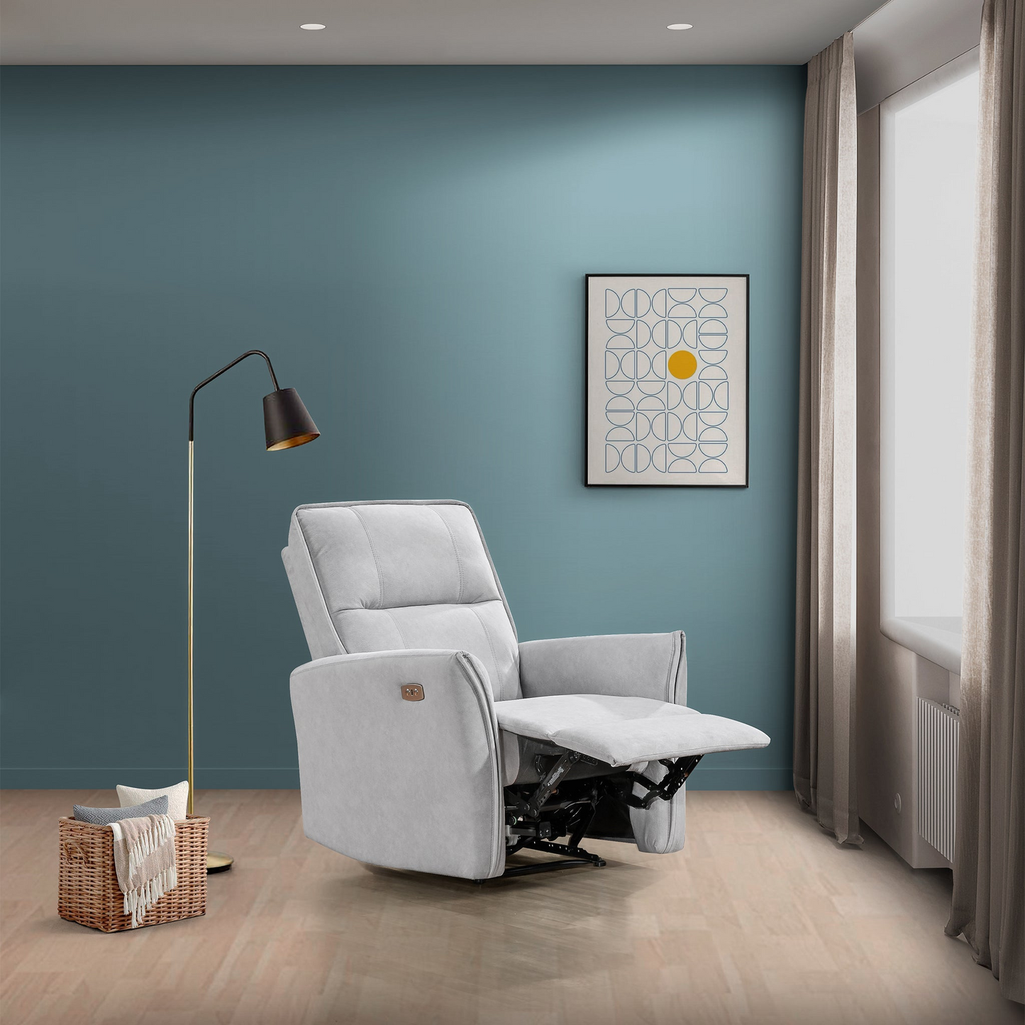 Modern light gray recliner chair in living room with blue wall, floor lamp, and wall art