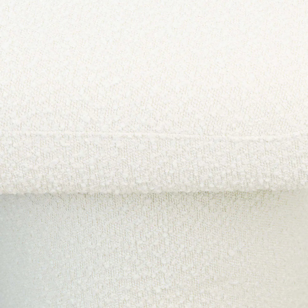 Close-up of textured white boucle upholstery on modern furniture from FredCo International