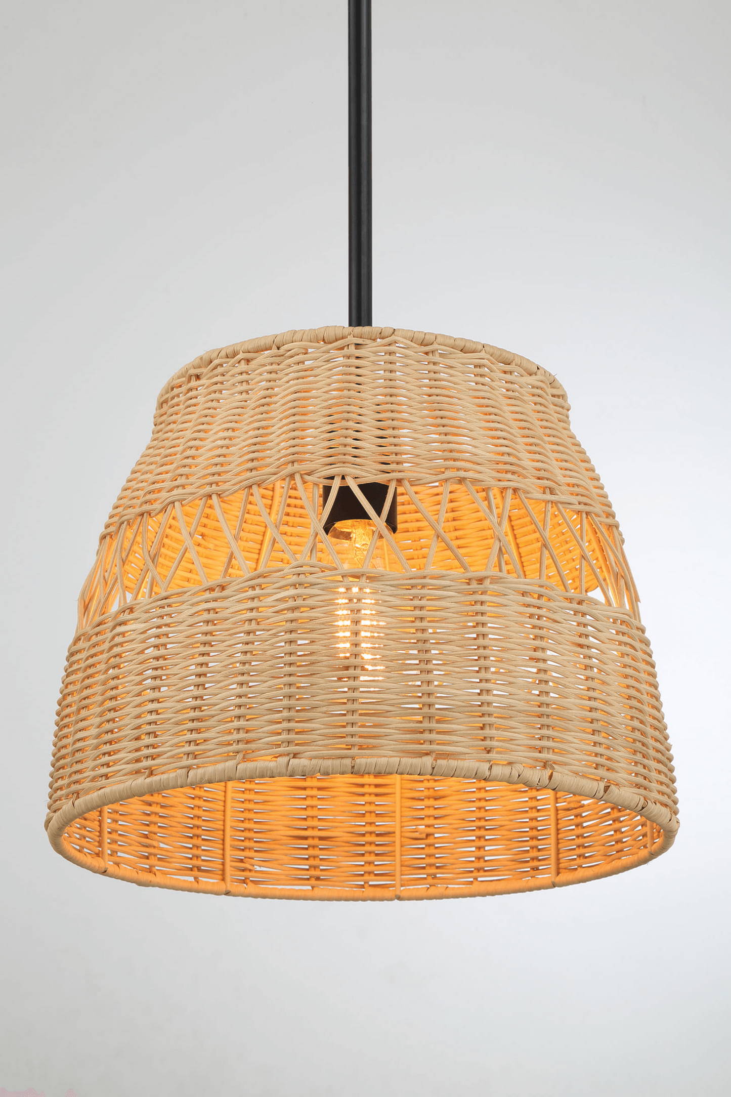 Woven rattan pendant light fixture with warm glow, modern home decor from FredCo International