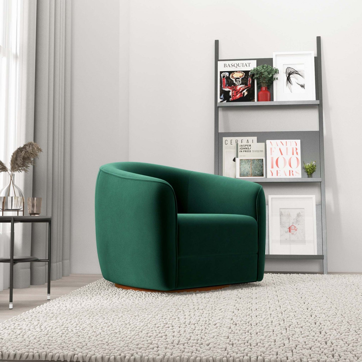 Modern green accent chair in living room with shelf and decorative books, FredCo International furniture
