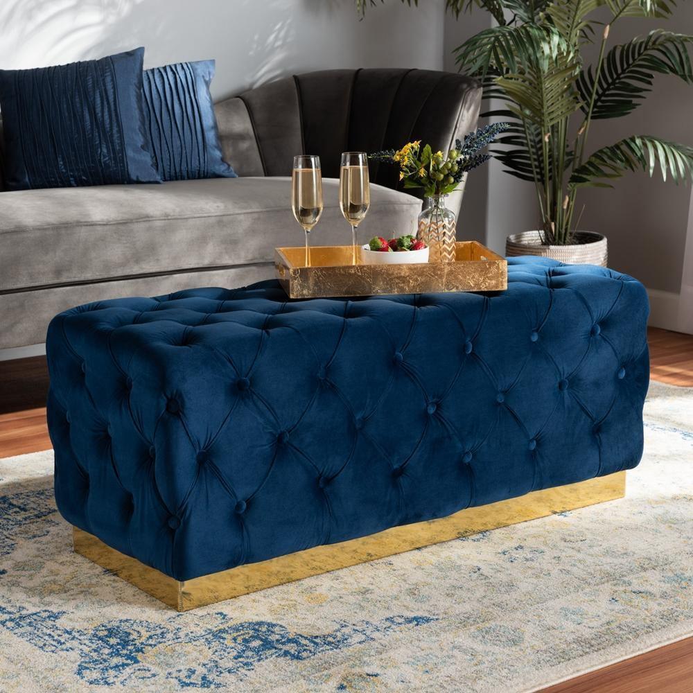 Corrine Glam and Luxe Navy Blue Velvet Fabric Upholstered and Gold PU Leather Ottoman FredCo