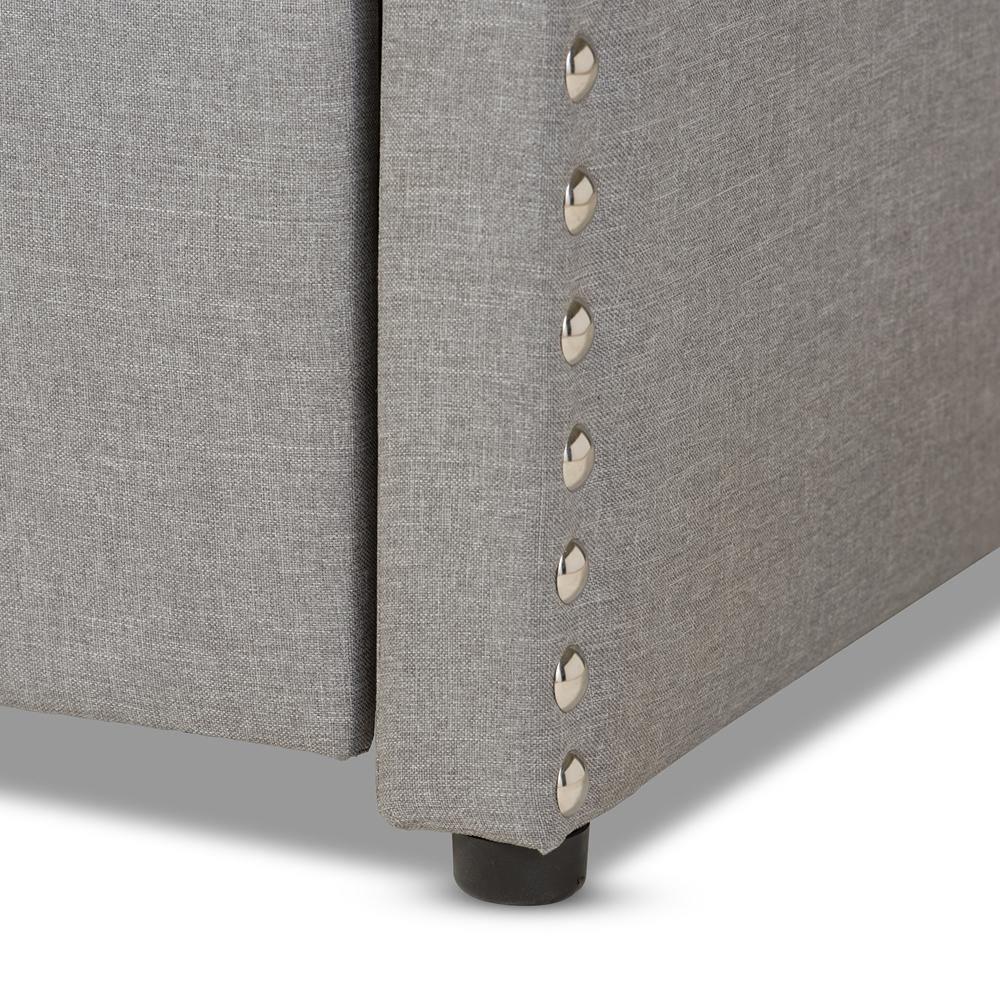 Lanny Modern and Contemporary Grey Fabric Nail Heads Trimmed Arched Back Sofa Twin Daybed with Roll-Out Trundle Guest Bed FredCo