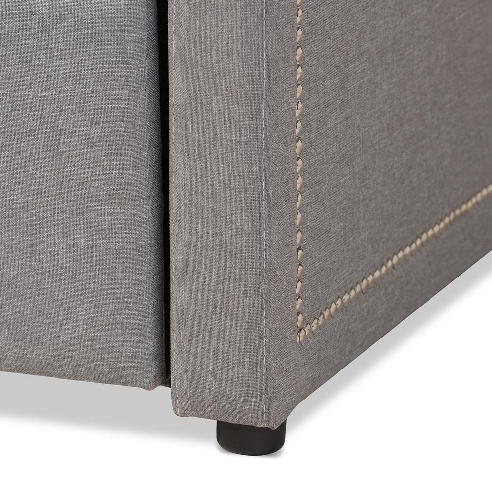 Raymond Modern and Contemporary Grey Fabric Nail Heads Trimmed Sofa Twin Daybed with Roll-Out Trundle Guest Bed FredCo