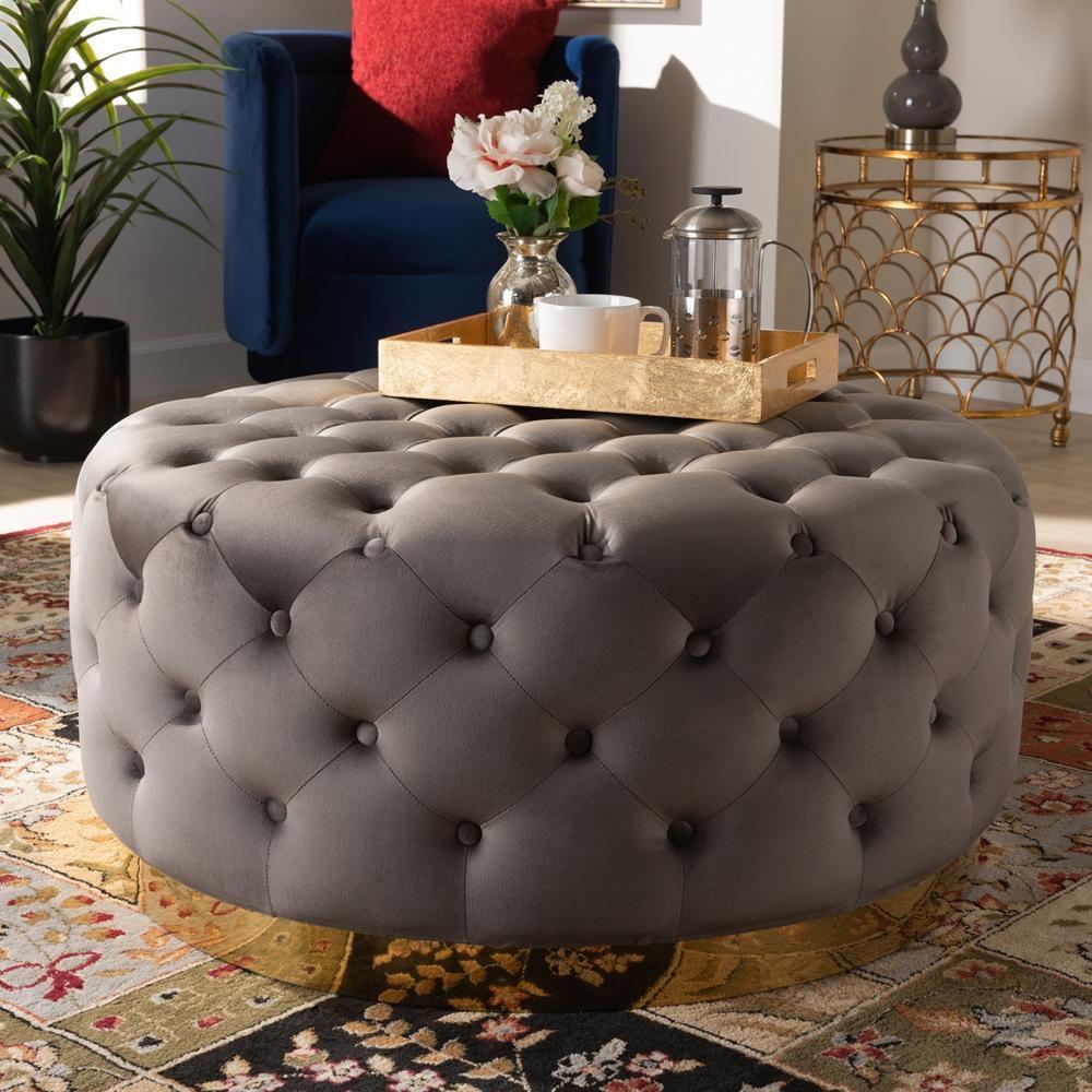 Sasha Glam and Luxe Grey Velvet Fabric Upholstered Gold Finished Round Cocktail Ottoman FredCo