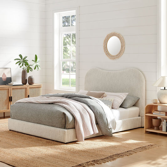 Modern boucle platform bed in bright bedroom with natural wood accents and cozy decor