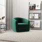 Modern green accent chair in a stylish living room with bookshelf and textured rug