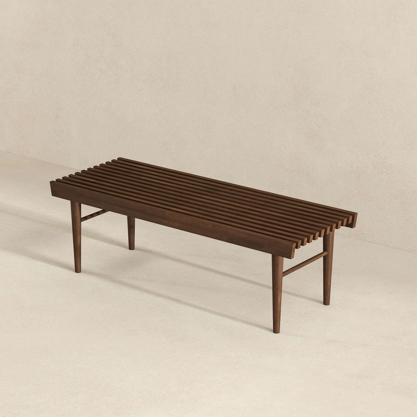 Modern slatted wood bench with tapered legs on minimal beige background, FredCo International furniture