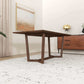 Modern wooden dining table in a stylish living room with sideboard and abstract wall art