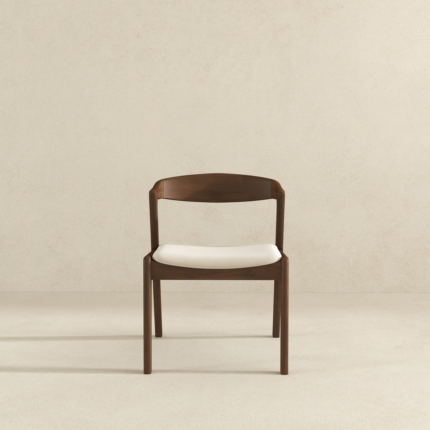 Modern wooden dining chair with white cushion on neutral background, FredCo International furniture
