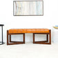 Modern tan leather bench with wooden legs in a bright living room, FredCo International furniture
