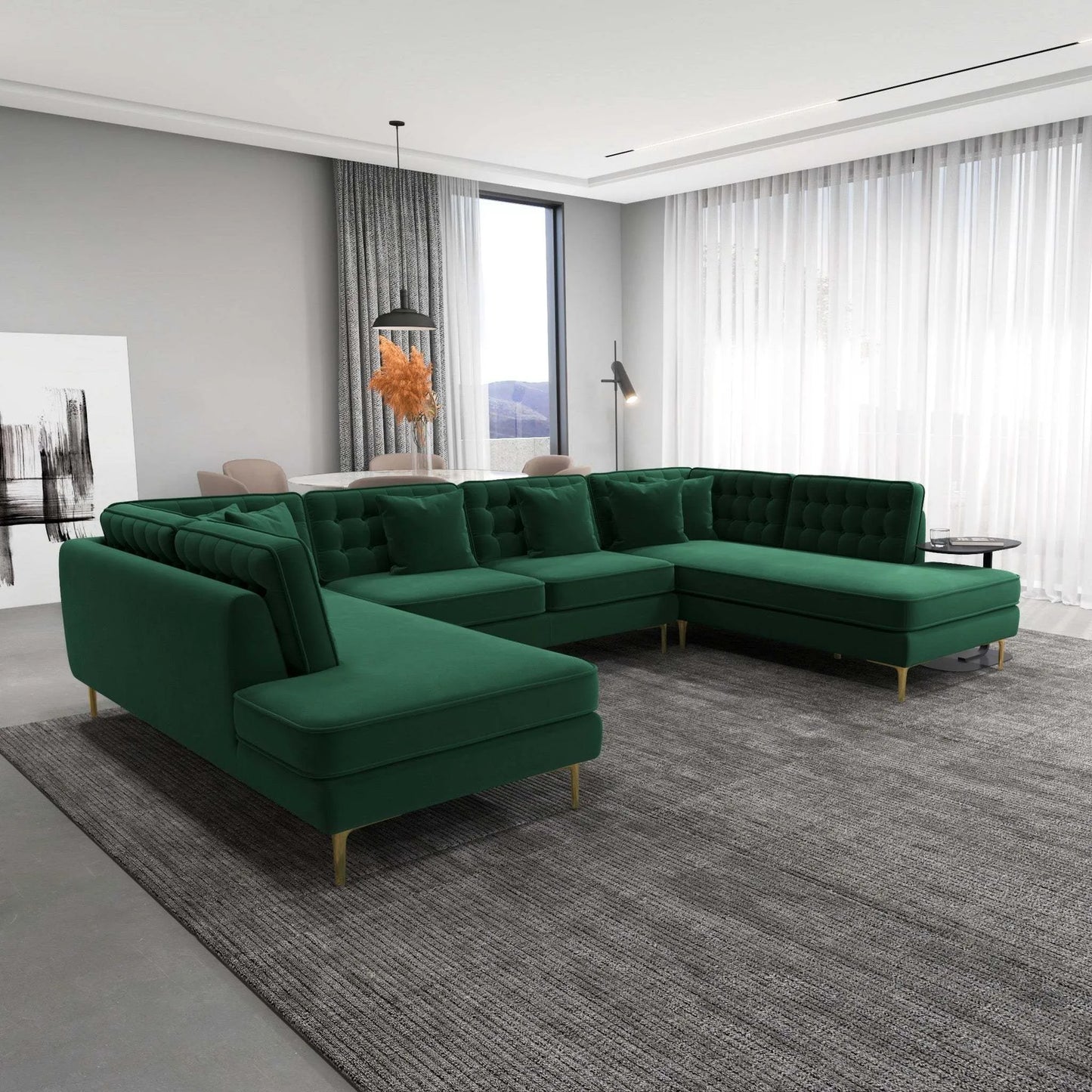 Modern living room with green sectional sofa on gray rug, large windows, and elegant decor