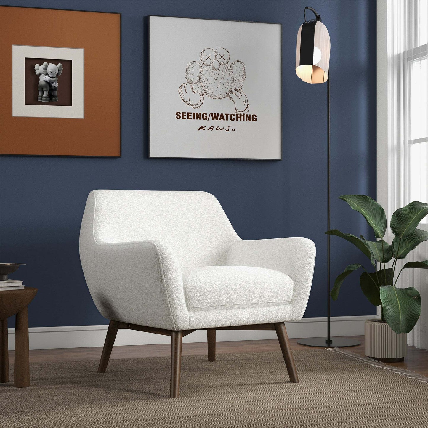 Modern living room with white accent chair, wall art, floor lamp, and indoor plant
