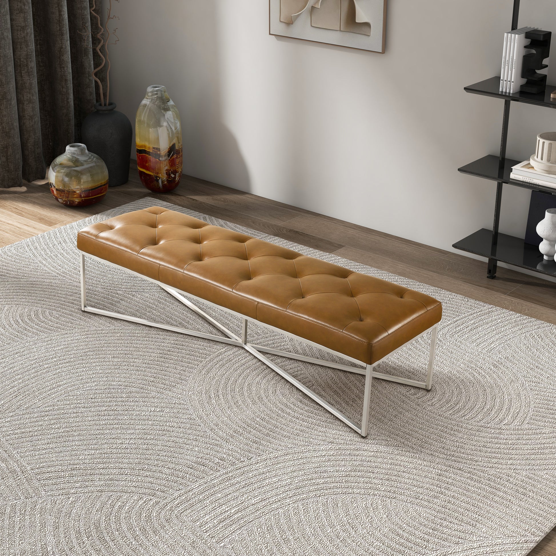 Modern tufted leather bench with metal legs on patterned rug in stylish living room