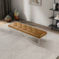 Modern tufted leather bench with metal legs on patterned rug in stylish living room
