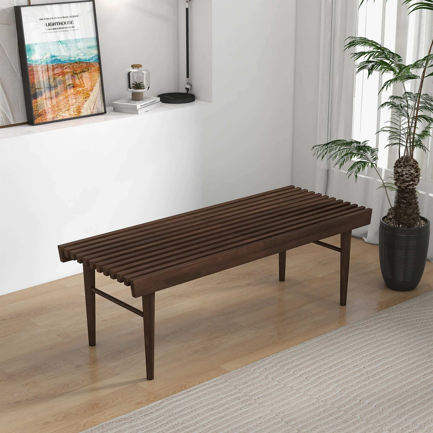 Modern slatted wooden bench in a bright living room with a plant and wall decor, FredCo International furniture
