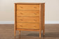 Baxton Studio Lucera Mid-Century Oak Brown Bobbin Wood 4-Drawer Chest