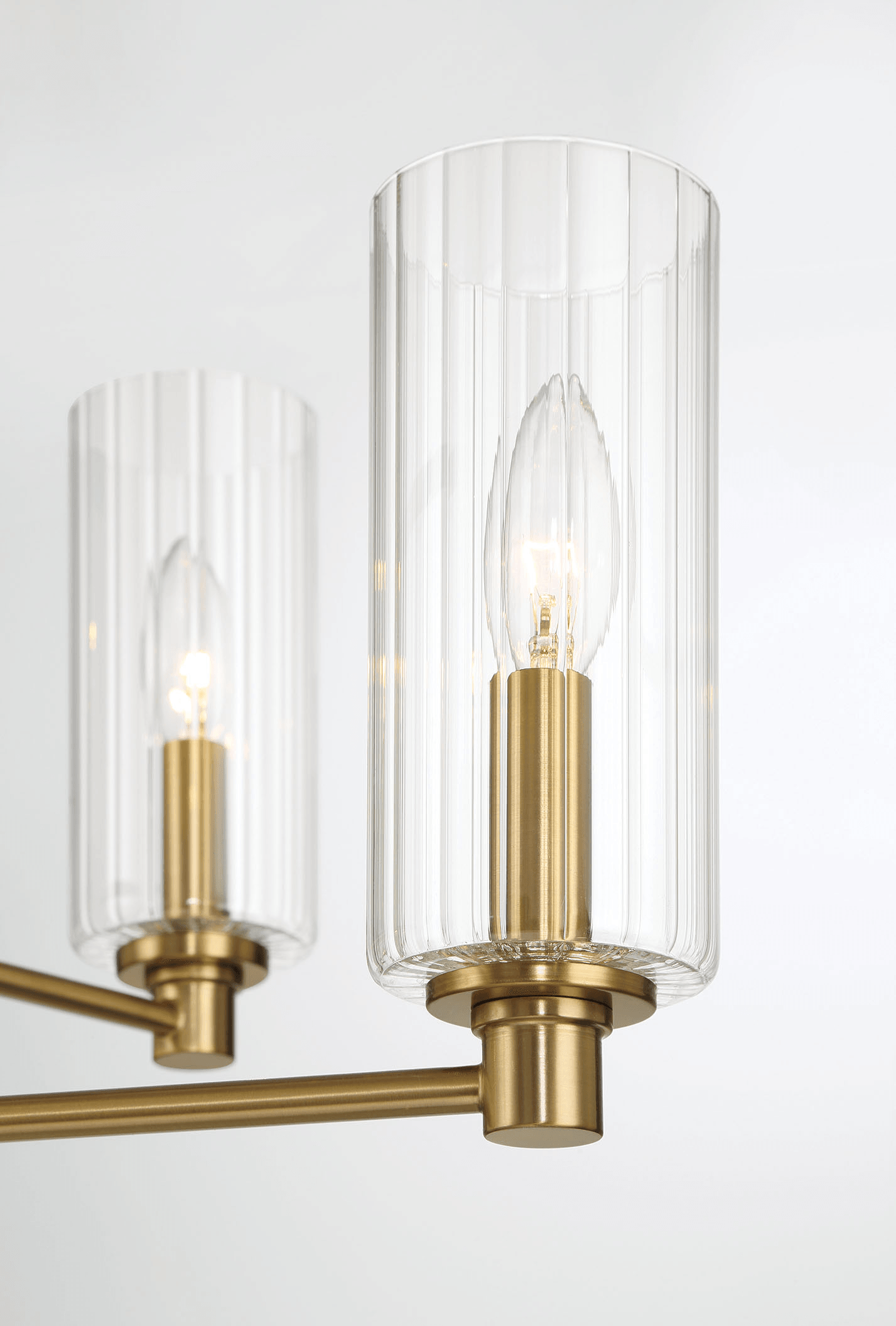 Modern brass and glass chandelier close-up, contemporary lighting from FredCo International