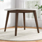Modern wood dining table with white top in bright living room, FredCo International furniture