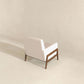 Modern beige armchair with wooden frame in minimalist room, FredCo International furniture