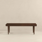Modern dark wood bench with clean lines on light background, FredCo International furniture
