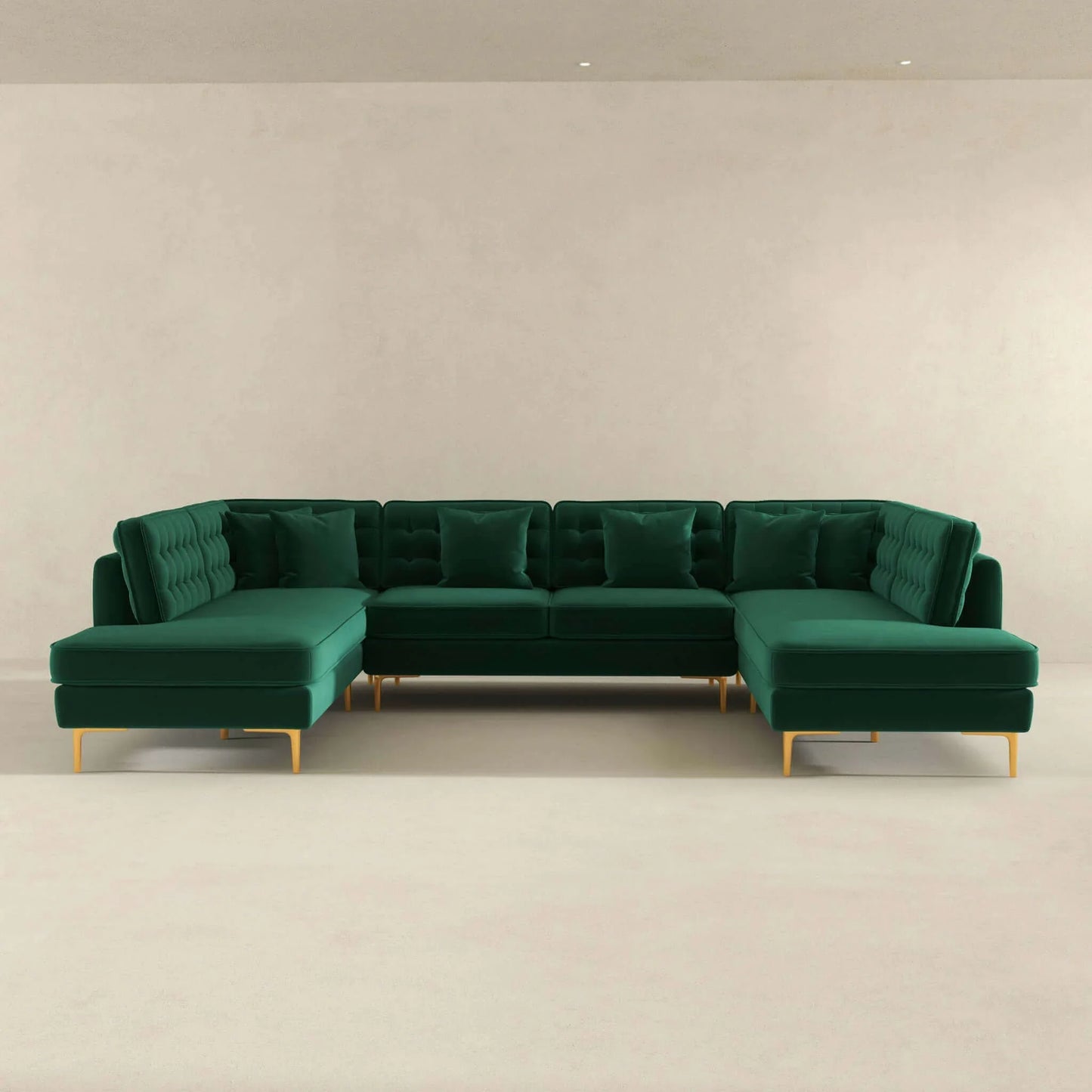 Modern green velvet sectional sofa with tufted cushions and gold legs in minimalist room