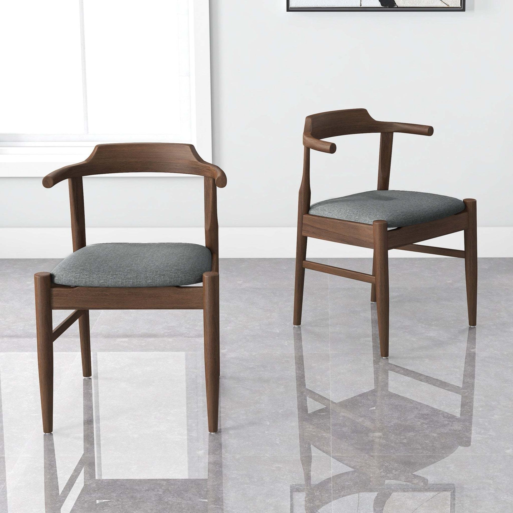 Modern wooden dining chairs with gray cushions in a bright room, FredCo International furniture
