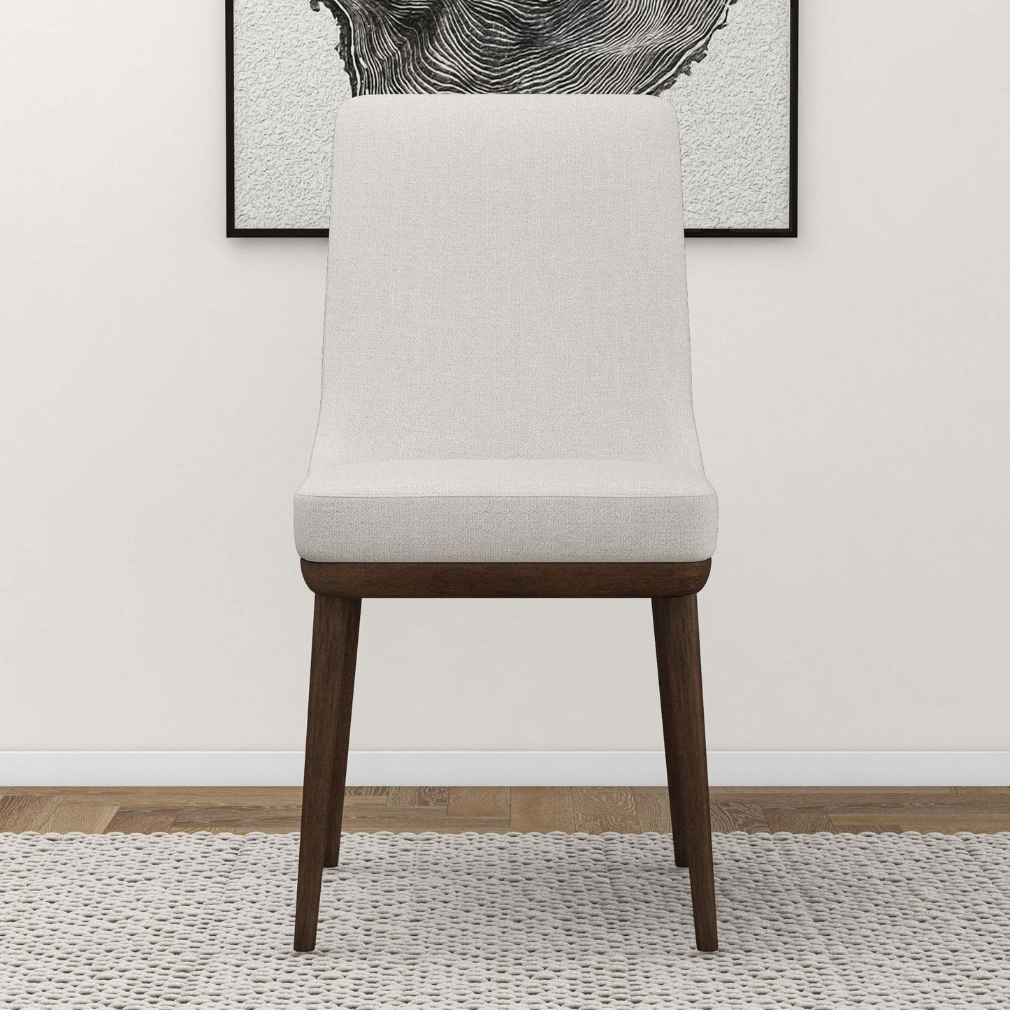 Modern upholstered accent chair with wooden legs on a textured rug, FredCo International furniture
