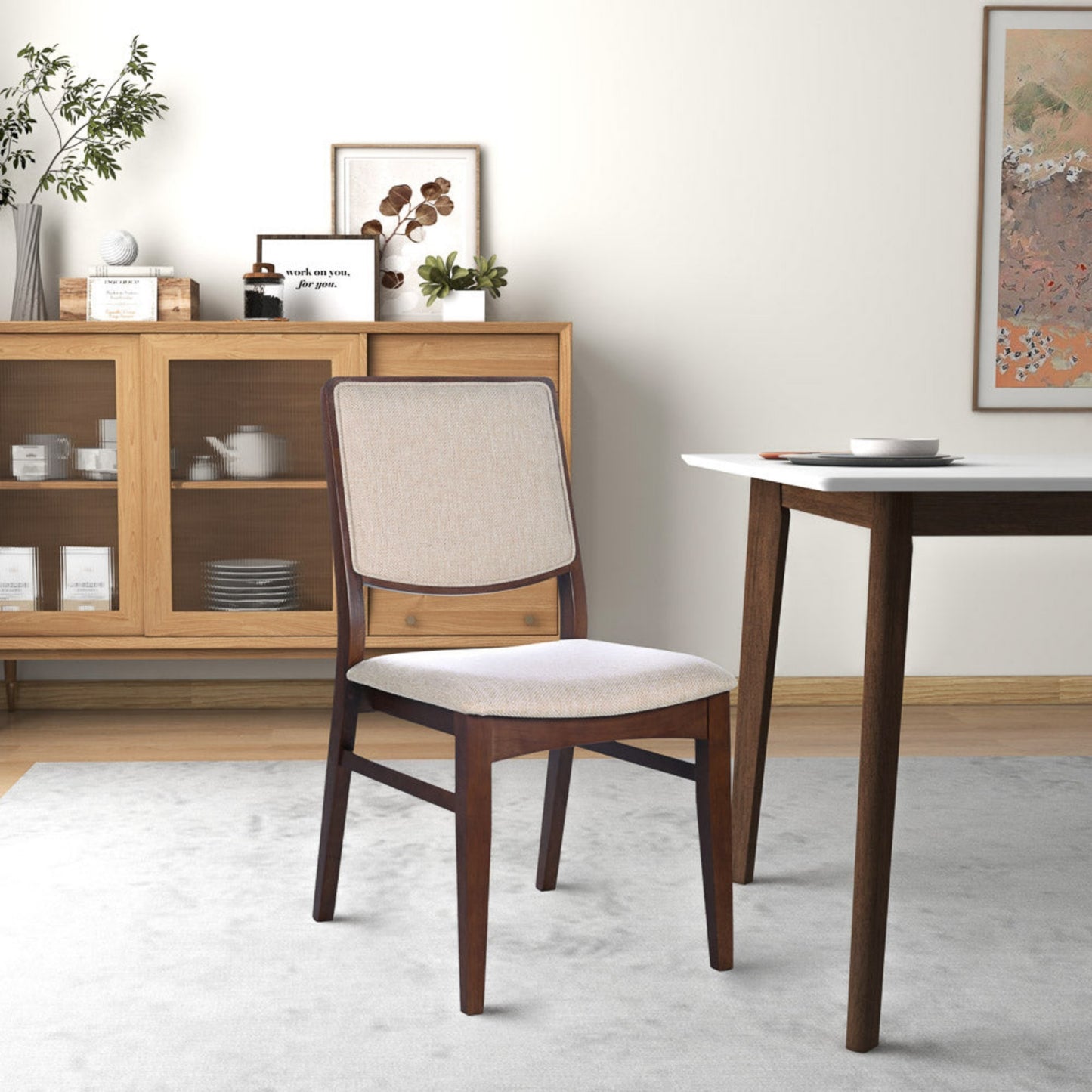 Modern wooden dining chair with beige upholstery in contemporary home setting