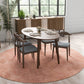 Modern oval dining table with four chairs on pink rug in bright dining room, FredCo furniture