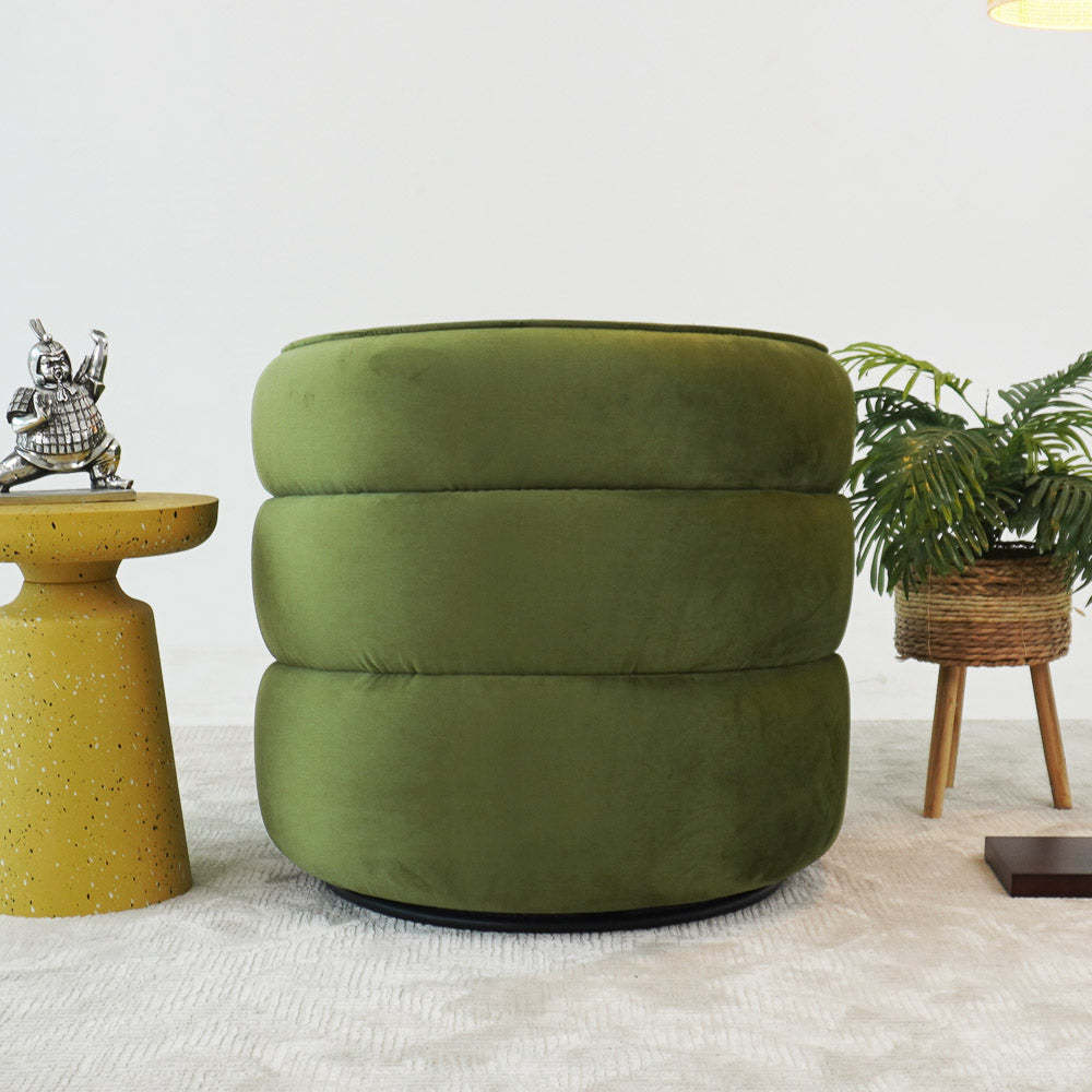 Green velvet ottoman with modern yellow side table in a stylish living room at FredCo International