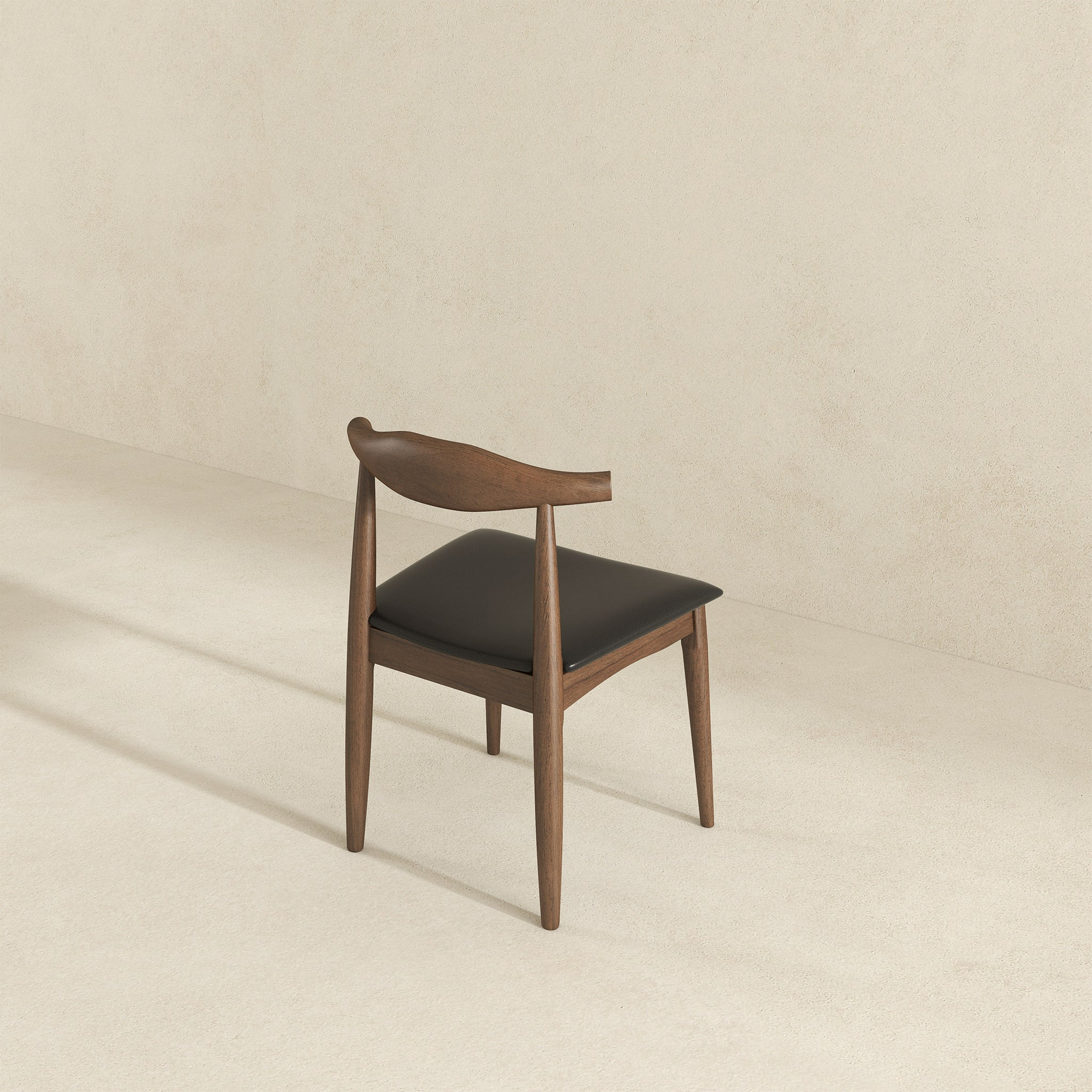 Modern wooden dining chair with dark cushion on neutral background, FredCo International furniture