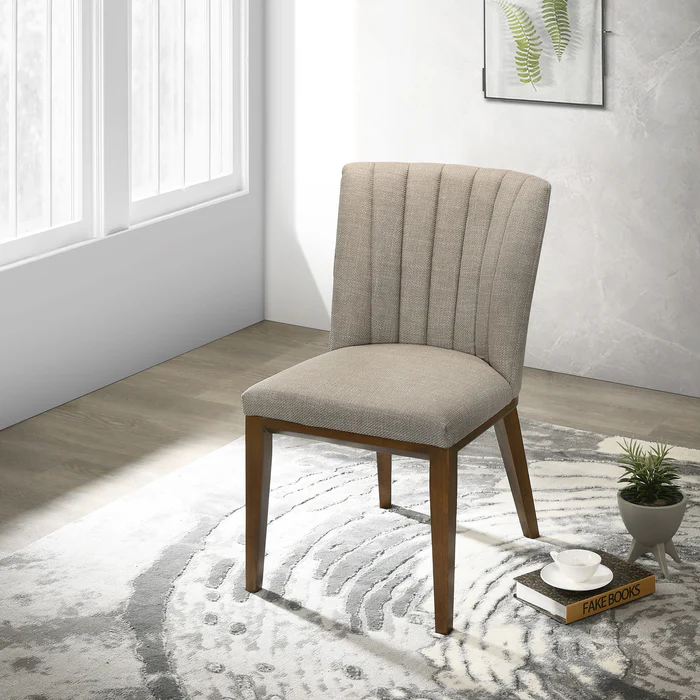 Modern upholstered accent chair with wooden legs in bright living room at FredCo International