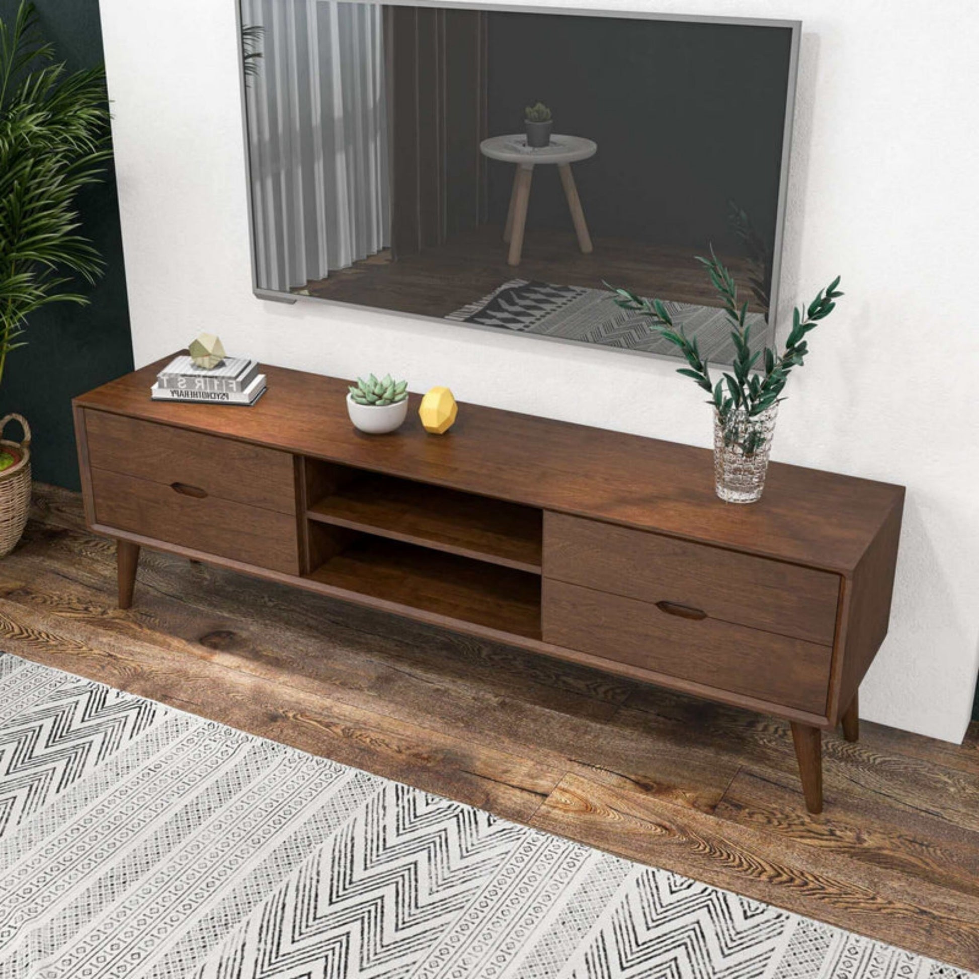 Mid-century modern wooden TV stand with drawers and plants in a stylish living room