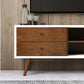 Mid-century modern wood sideboard with glassware on top in a stylish living room