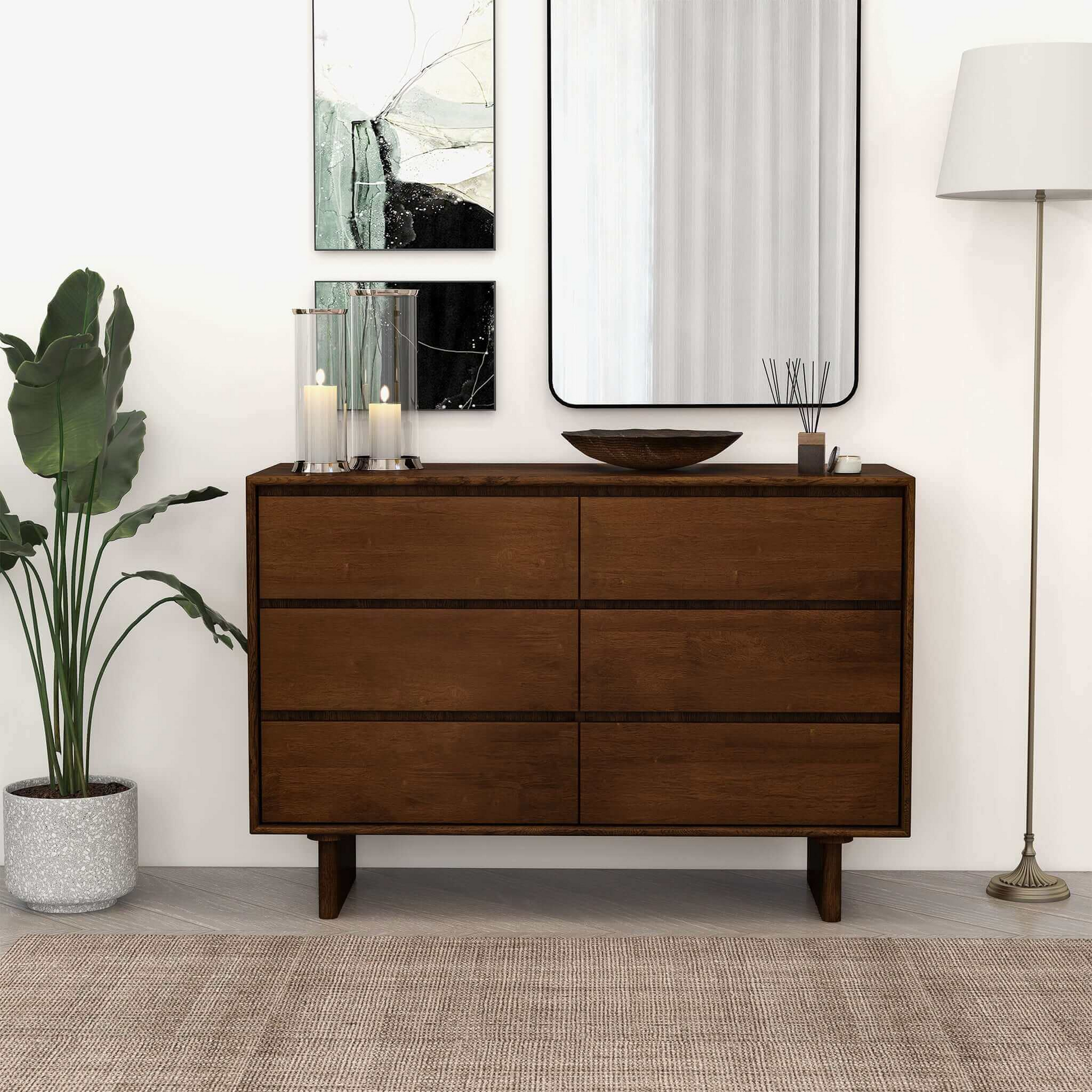 Modern wooden dresser in a stylish living room with decor, artwork, and floor lamp