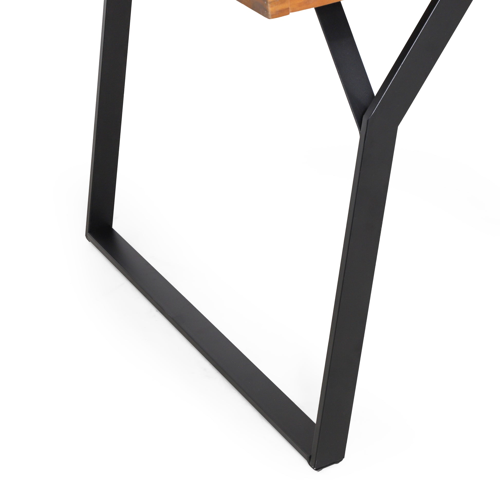 Modern black metal table leg with wooden tabletop, contemporary furniture detail