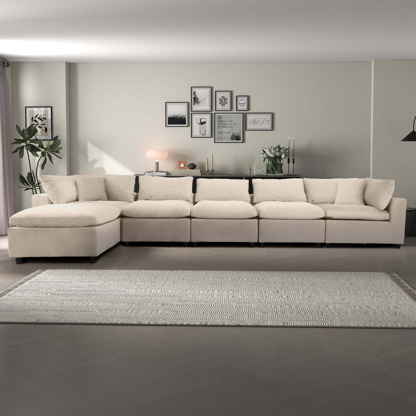 Modern beige sectional sofa in stylish living room with wall art, rug, and houseplants
