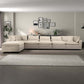 Modern beige sectional sofa in stylish living room with wall art, rug, and houseplants