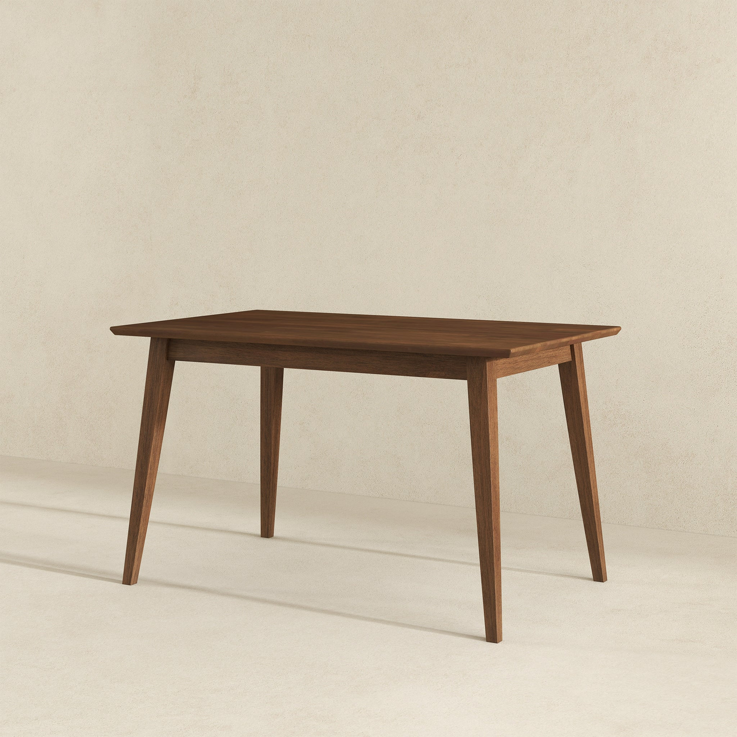 Modern wooden dining table with angled legs on light background, FredCo International furniture