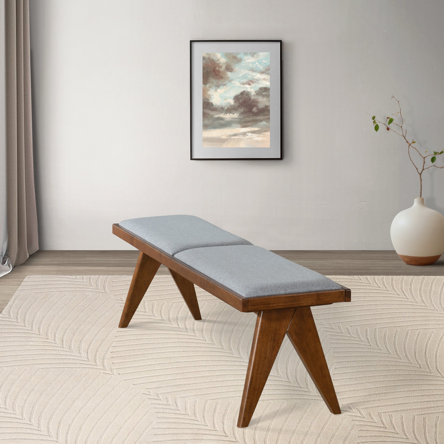 Modern wooden bench with gray cushion in stylish living room, FredCo International furniture