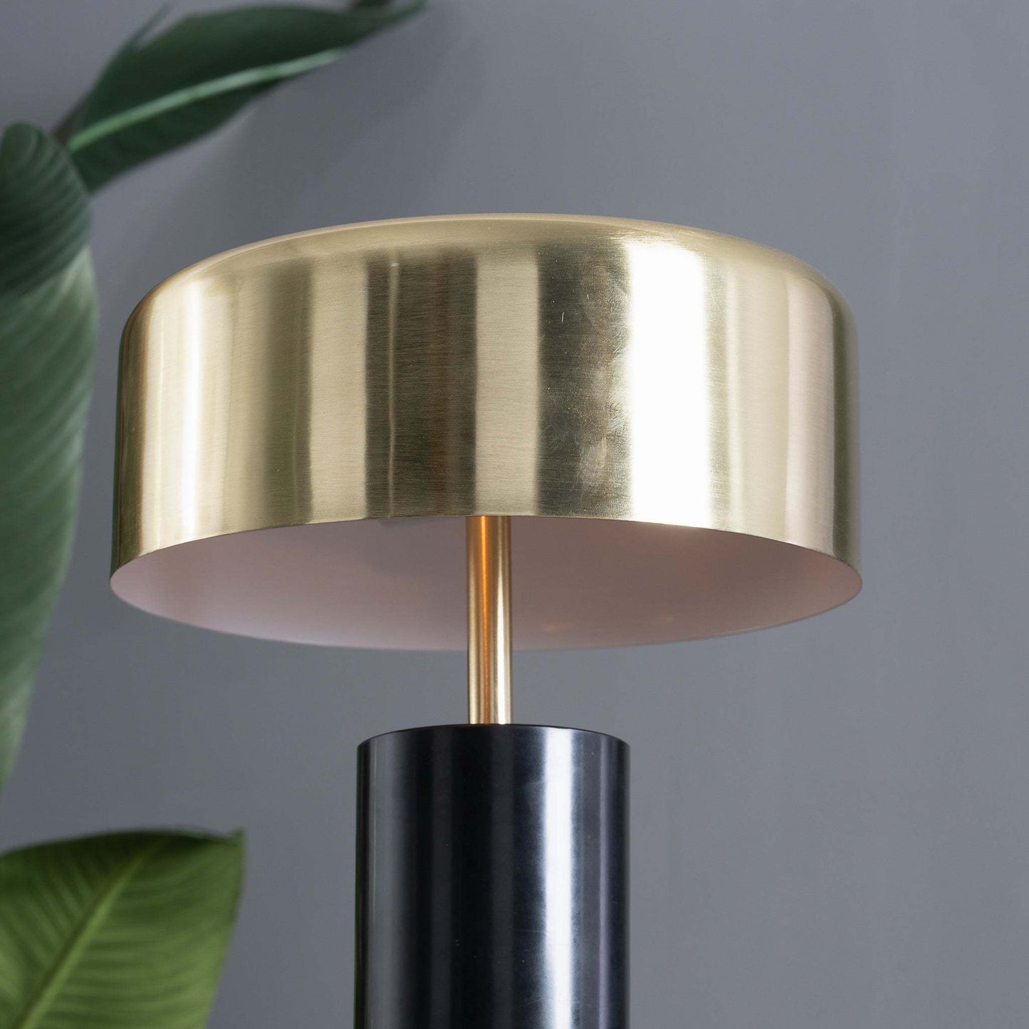 Modern gold and black table lamp with cylindrical shade, indoor home decor by FredCo International
