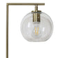 Modern brass lamp with clear glass globe shade and exposed bulb from FredCo International