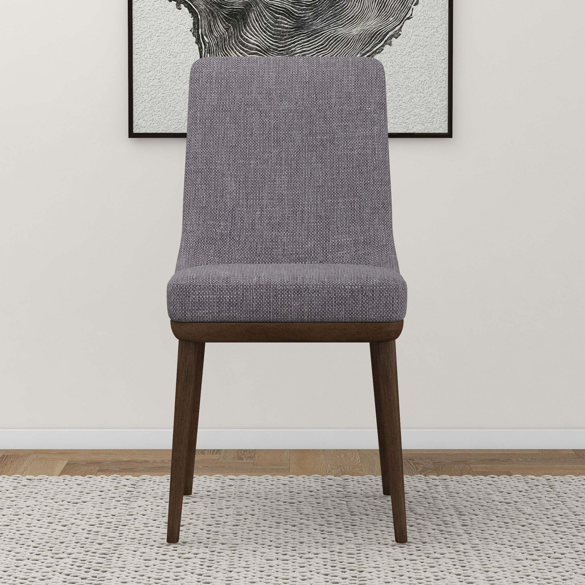 Modern gray upholstered dining chair with wooden legs on rug, FredCo International furniture