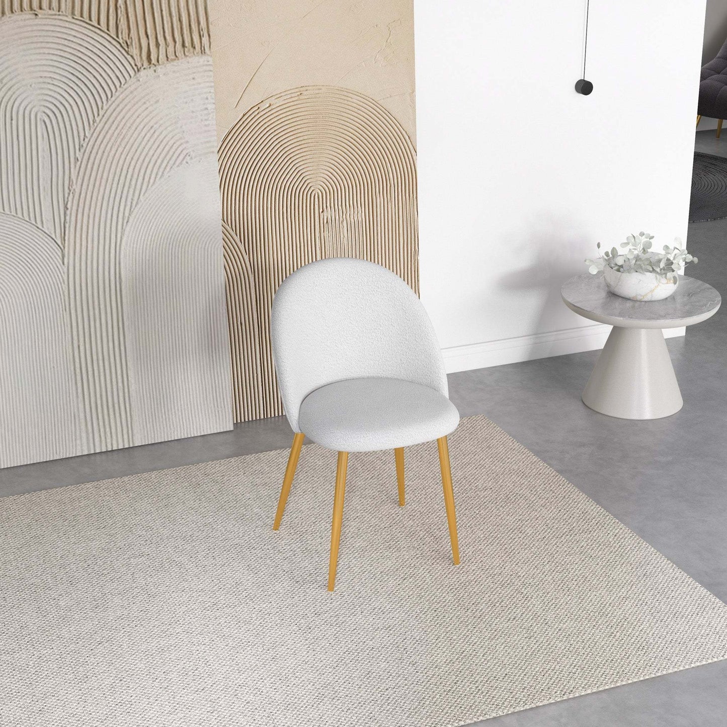 Modern white accent chair with wood legs on a neutral rug in contemporary living room