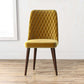 Modern mustard yellow dining chair with quilted back and wooden legs on wood floor