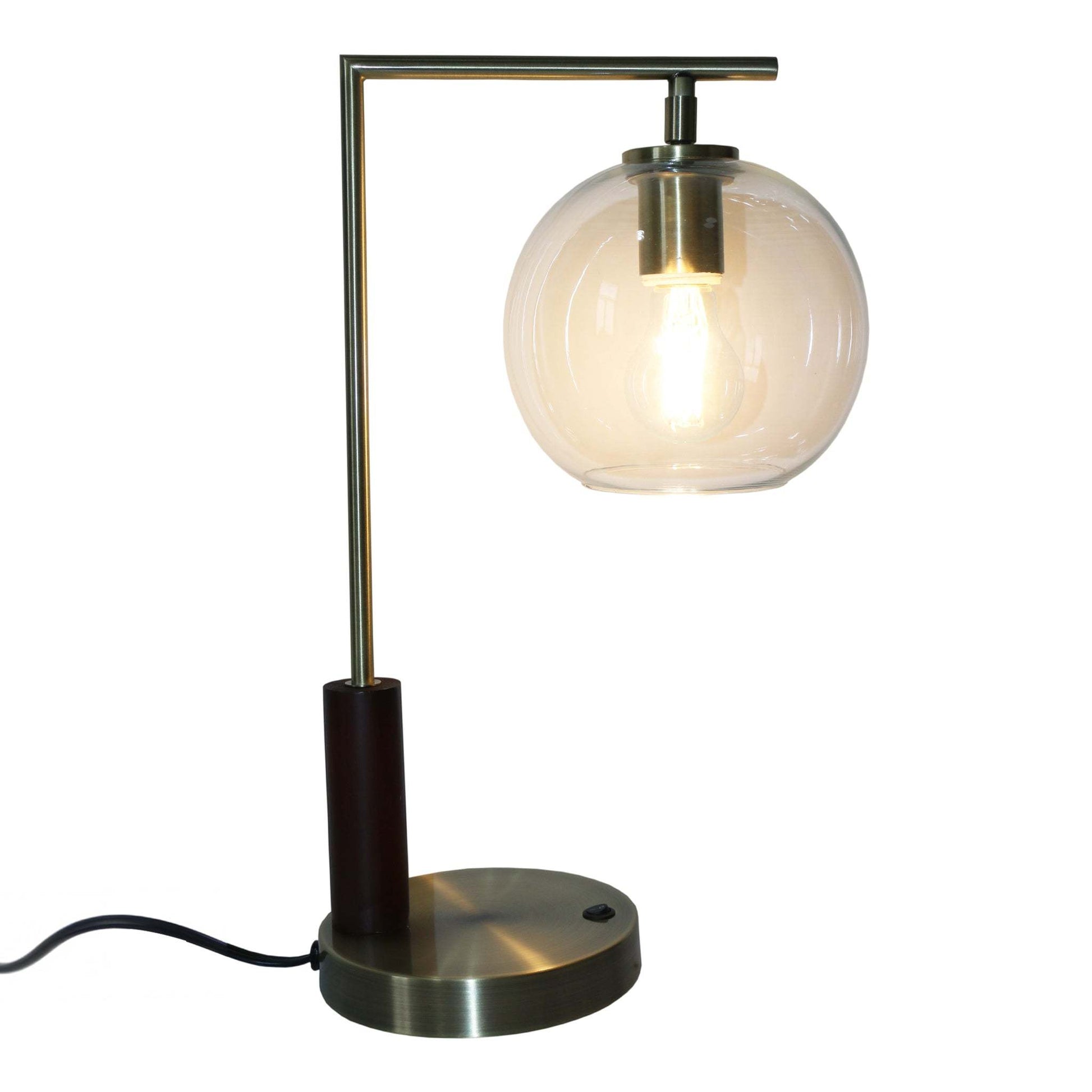 Modern brass table lamp with round glass shade and exposed bulb, FredCo International furniture