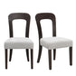 Set of two modern dining chairs with dark wooden frames and light upholstered seats