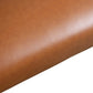 Close-up of brown faux leather upholstery texture, ideal for furniture from FredCo International.
