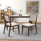 Modern dining room with two wooden chairs, a minimalist table, and neutral decor
